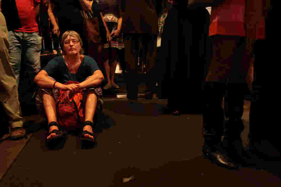 With standing room the only available option at the back of Trinity Church, Ulrike Kohl from Germany closes her eyes as she listens to "Remember to Love: Let Us Love One Another With A Sincere Heart."