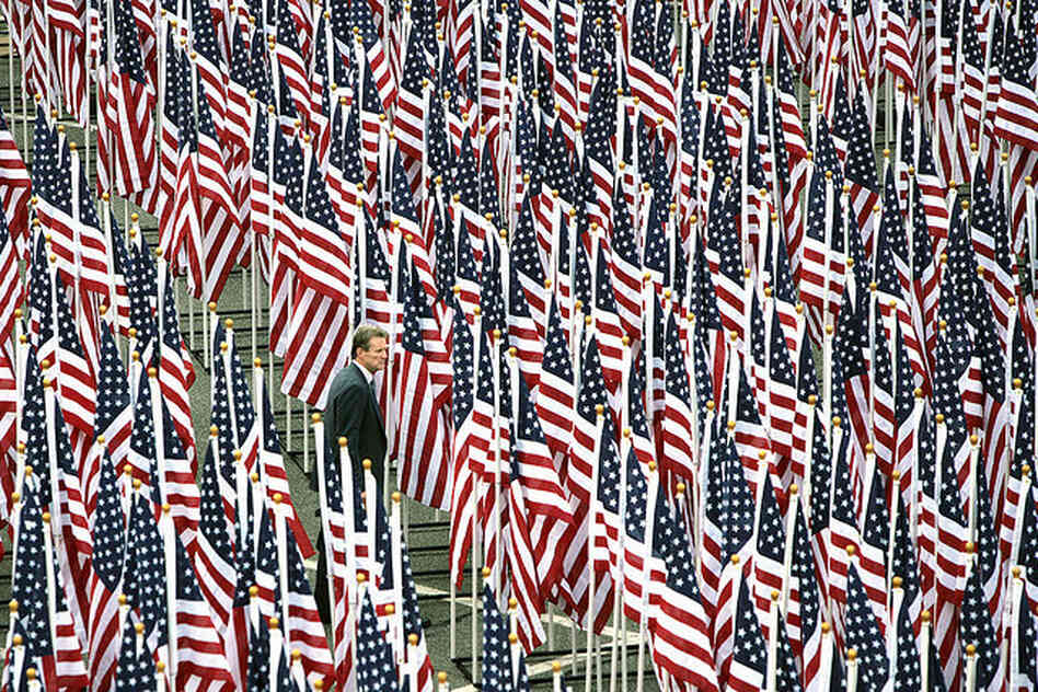 A man walks through the Healing Field flag display near the Pentagon Memorial prior to the dedication ceremony Sept. 11.