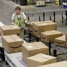 Stephen Guymon, of Twin Falls, Idaho, separates packages for final shipment inside the 800,000-square-foot Amazon.com warehouse in Goodyear, Ariz. Stephen Guymon, of Twin Falls, Idaho, separates packages for final shipment inside the 800,000-square-foot Amazon.com warehouse in Goodyear, Ariz.