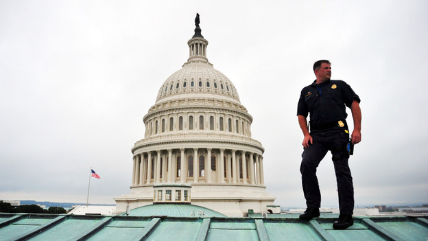 A U.S. Capitol policeman performs a security sweep of the Capitol Dome and roof ahead of President Obama's speech to Congress on Thursday. The U.S. is spending more than $70 billion on homeland security this year, up from $20 billion a decade ago.