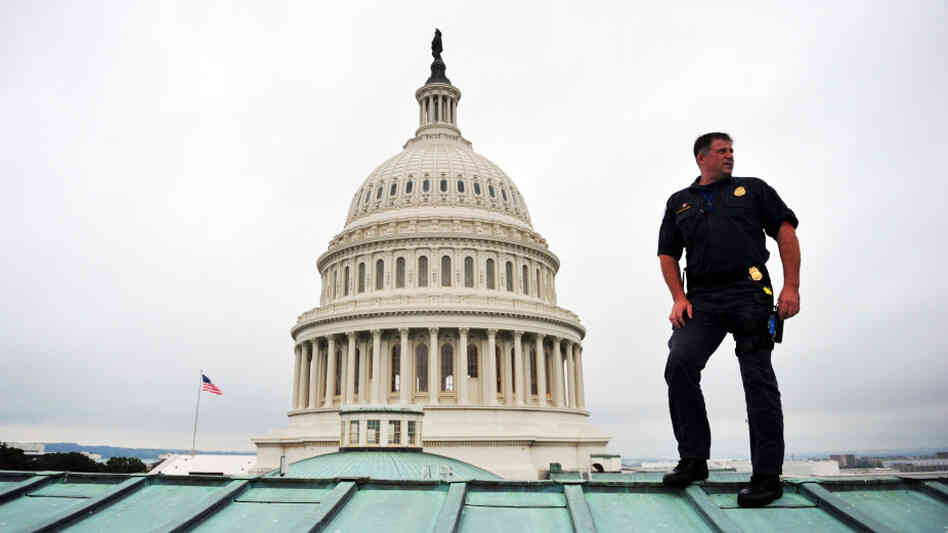 A U.S. Capitol policeman performs a security sweep of the Capitol Dome and roof ahead of President Obama's speech to Congress on Thursday. The U.S. is spending more than $70 billion on homeland security this year, up from $20 billion a decade ago.