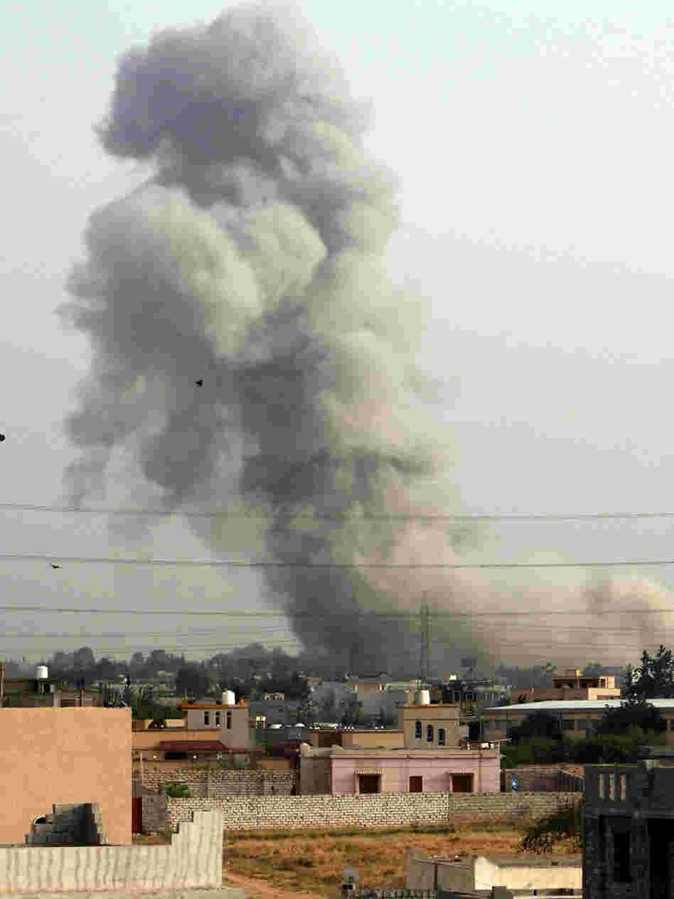 Smoke billows from a suburb of the Libyan capital Tripoli, on June 4, after a NATO air strike. NATO planes bombed Libya for months, assisting rebels who eventually ousted Moammar Gadhafi.