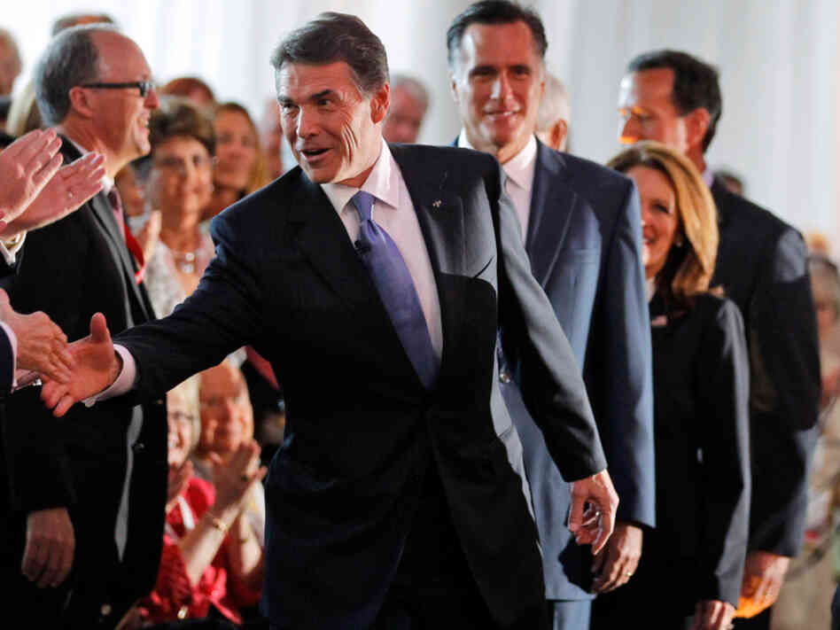 Republican presidential candidates, from left, Texas Gov. Rick Perry, former Massachusetts Gov. Mitt Romney and Rep. Michele Bachmann, R-Minn., enter the hall for a Republican presidential candidate debate at the Reagan Library on Sept. 7. Republican presidential candidates, from left, Texas Gov. Rick Perry, former Massachusetts Gov. Mitt Romney and Rep. Michele Bachmann, R-Minn., enter the hall for a Republican presidential candidate debate at the Reagan Library on Sept. 7.
