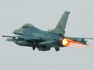 An F-16 fighter jet. An F-16 fighter jet.