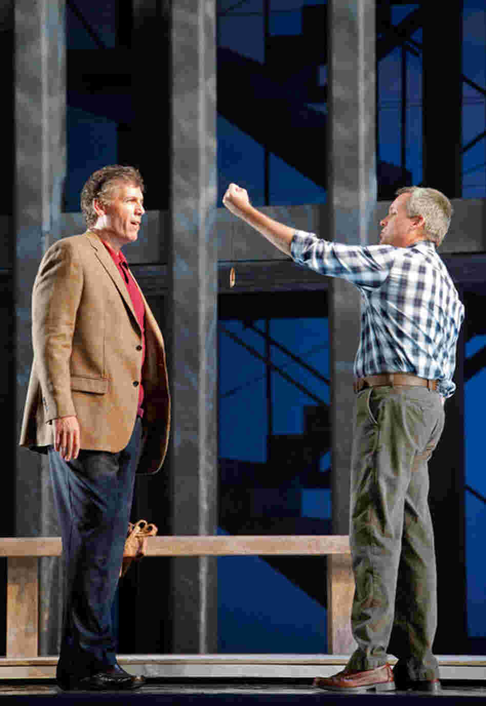 Rick Rescorla (Thomas Hampson, left) accepts a protective talisman from Dan Hill (William Burden) in front ot the World Trade Center.