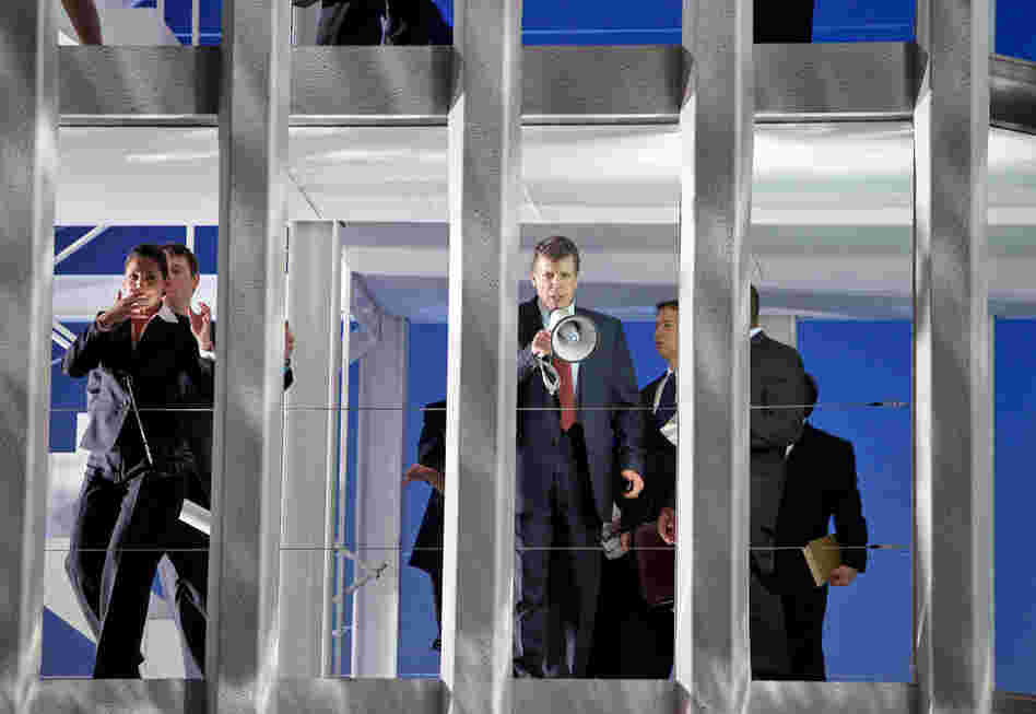 Rick Rescorla (Thomas Hampson, center) helps his co-workers out of the damaged World Trade Center.