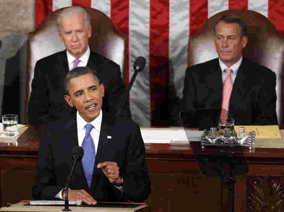 President Obama delivers a speech about creating jobs to a joint session of Congress Thursday as Vice President Biden (left) and House Speaker John Boehner look on.