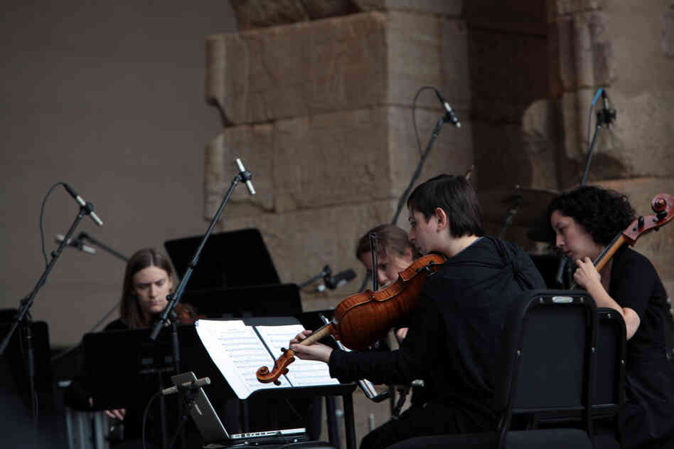 The quartet plays "Tenebrae" by Osvaldo Golijov at the Remembering September 11 concert by the Wordless Music Orchestra conducted by Ryan McAdams presented at The Temple of Dendur at The Metropolitan Museum of Art in Manhattan, NY on September 11, 2011.
