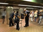 Police officers watch travelers at the entrance of the Grand Central subway terminal in New York on Thursday. Security measures around the city were increased two days before the 10th anniversary of the Sept. 11 attacks. Police officers watch travelers at the entrance of the Grand Central subway terminal in New York on Thursday. Security measures around the city were increased two days before the 10th anniversary of the Sept. 11 attacks.
