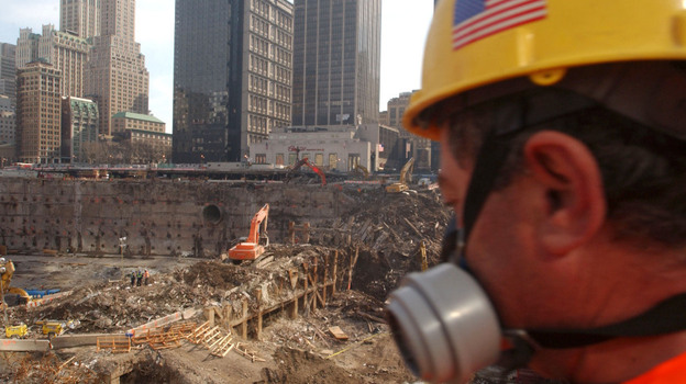 A worker looks over the field of debris of the collapsed south tower area of the World Trade Center in March 2002 in New York City. Many workers chose not to wear the respirators provided for them, except in the most extreme conditions. (Spencer Platt/Getty Images) A worker looks over the field of debris of the collapsed south tower area of the World Trade Center in March 2002 in New York City. Many workers chose not to wear the respirators provided for them, except in the most extreme conditions. (Spencer Platt/Getty Images)