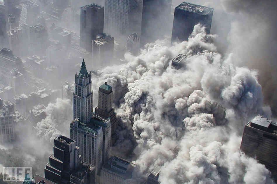 The North Tower collapses, engulfing Lower Manhattan in smoke and ash. 