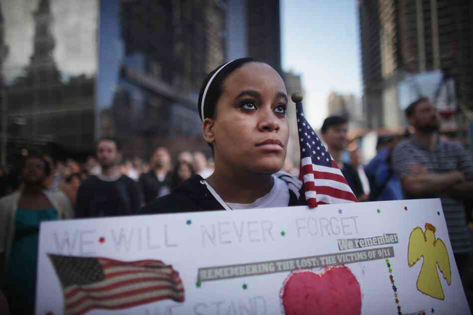 Nia Evans, who lost a friend at the World Trade Center, observes a moment of silence in New York City. 