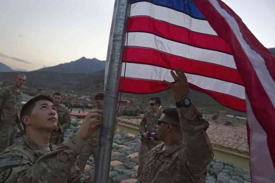 Capt. Cameron Mays, 27, of Marion, Ky., left, and Spc. Angel Batista, 26, of Bloomingdale, N.J., with the U.S. Army's 25th Infantry Division, 3rd Brigade Combat Team, 2nd Battalion 27th Infantry Regiment based in Schofield Barracks, Hawaii, raise a new American flag to commemorate the tenth anniversary of the 9/11 attacks at Forward Operating Base Bostick in Kunar province, Afghanistan. Capt. Cameron Mays, 27, of Marion, Ky., left, and Spc. Angel Batista, 26, of Bloomingdale, N.J., with the U.S. Army's 25th Infantry Division, 3rd Brigade Combat Team, 2nd Battalion 27th Infantry Regiment based in Schofield Barracks, Hawaii, raise a new American flag to commemorate the tenth anniversary of the 9/11 attacks at Forward Operating Base Bostick in Kunar province, Afghanistan.