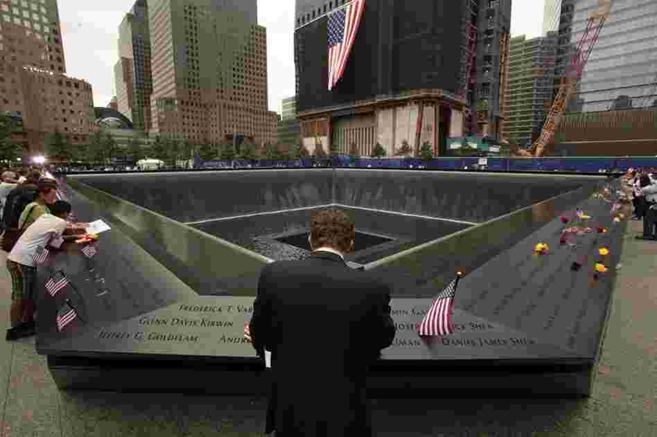 Michael Lehrman, Executive Managing Director of Cantor Fitzgerld and Co., bows his head at the names of some of the over 600 employees from Cantor Fitzgerald who lost their lives in the Sept. 11 attacks, at the 9/11 memorial in New York City. 