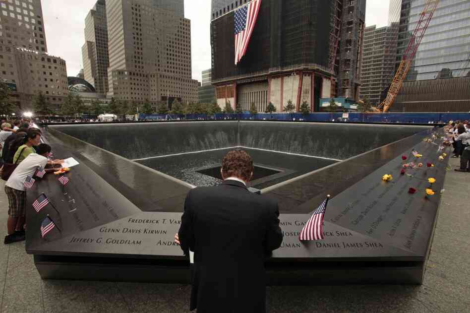 Michael Lehrman, Executive Managing Director of Cantor Fitzgerld and Co., bows his head at the names of some of the over 600 employees from Cantor Fitzgerald who lost their lives in the Sept. 11 attacks, at the 9/11 memorial in New York City. 