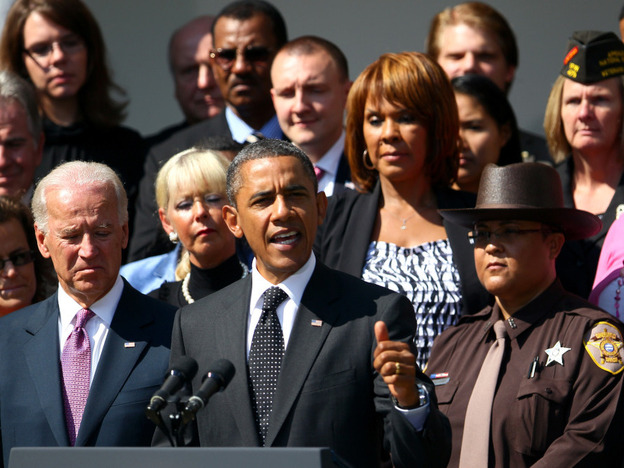 President Obama, flanked by Vice President Joe Biden and teachers, veterans, construction workers, police officers and firefighters, introduces the American Jobs Act in the Rose Garden of the White House on Monday.
