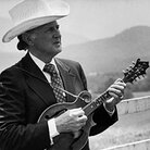 A poor, cross-eyed boy from Kentucky, Bill Monroe created the hard-driving, high-lonesome genre known as bluegrass. A poor, cross-eyed boy from Kentucky, Bill Monroe created the hard-driving, high-lonesome genre known as bluegrass.
