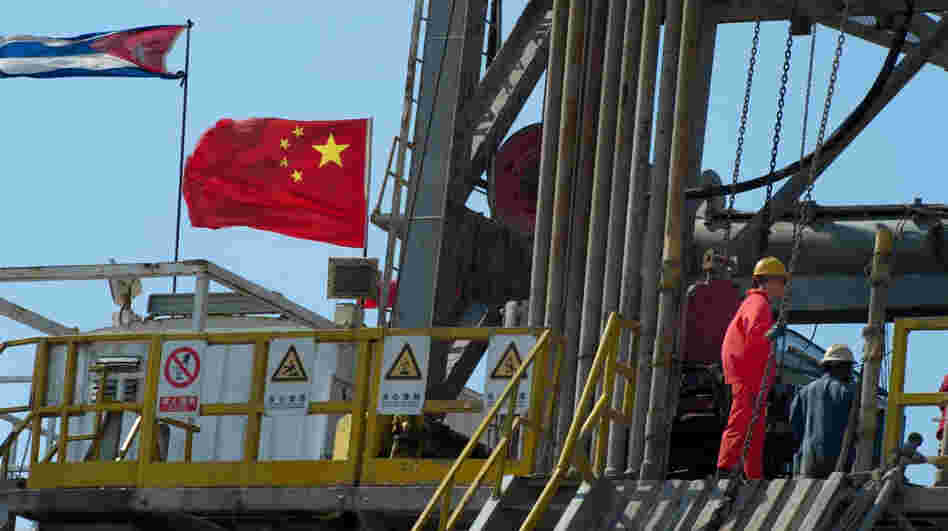 Employees work on an oil rig operated by Cuba and China in Havana in April. A Chinese-built rig is expected to begin drilling exploratory wells off Cuba's northwest coast as early as November, raising environmental concerns in the U.S.