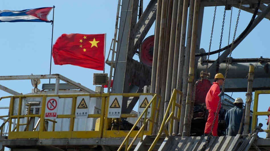 Employees work on an oil rig operated by Cuba and China in Havana in April. A Chinese-built rig is expected to begin drilling exploratory wells off Cuba's northwest coast as early as November, raising environmental concerns in the U.S.