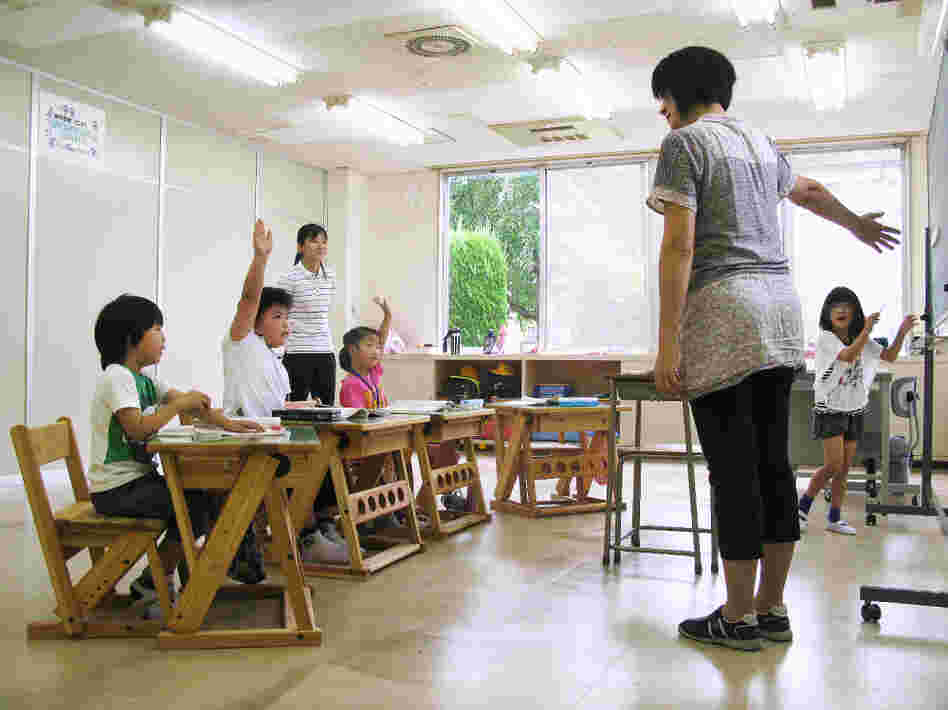 Four first-grade students study at the Tomioka Town Joint  Temporary School. The school, housed into a  soon-to-be-abandoned auto parts factory, is home to refugee pupils from  Fukushima  prefecture's radiation zone.