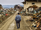 A 9.0-magnitude earthquake struck Japan offshore on March 11, setting into motion a tsunami that engulfed large parts of northeastern Japan and triggered a nuclear meltdown at a power plant in Fukushima. On March 26, a man walks among debris in Rikuzentakata, Iwate Prefecture, Japan. A 9.0-magnitude earthquake struck Japan offshore on March 11, setting into motion a tsunami that engulfed large parts of northeastern Japan and triggered a nuclear meltdown at a power plant in Fukushima. On March 26, a man walks among debris in Rikuzentakata, Iwate Prefecture, Japan.