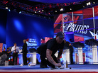 A worker cleans the stage for Monday evening's Republican presidential debate sponsored by CNN and the Tea Party Express, Sept. 12, 2011. A worker cleans the stage for Monday evening's Republican presidential debate sponsored by CNN and the Tea Party Express, Sept. 12, 2011.