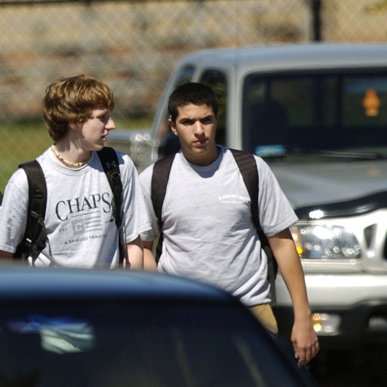 Students walk to their cars after school at Severna Park High School in Severna Park, Md. Researchers say tougher licensing laws have led to fewer fatal car crashes involving 16-year-old drivers.