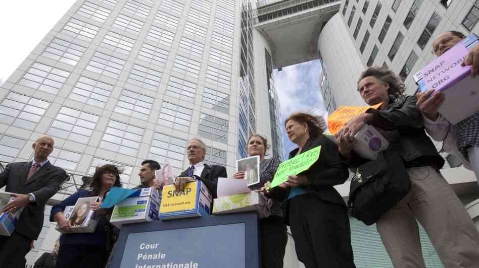 Members of the Survivors Network of those Abused by Priests pose in front of the International Criminal Court in The Hague, Netherlands, Tuesday. A group representing the victims is asking the world court to investigate top Vatican officials over the clerical sex abuse scandal. Members of the Survivors Network of those Abused by Priests pose in front of the International Criminal Court in The Hague, Netherlands, Tuesday. A group representing the victims is asking the world court to investigate top Vatican officials over the clerical sex abuse scandal.