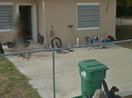 That blur in front of the door is a very naked woman in Miami. That blur in front of the door is a very naked woman in Miami.