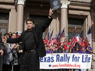 Texas Gov. Rick Perry waves to the crowd after speaking at an anti-abortion rally on the Capitol steps in Austin on Jan. 23, 2010. Texas Gov. Rick Perry waves to the crowd after speaking at an anti-abortion rally on the Capitol steps in Austin on Jan. 23, 2010.