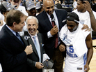The NCAA lost control of college football contracts in the 1980s, forcing it to rely on fees paid to broadcast its annual basketball tournament. Here, CBS broadcasters Jim Nantz, left, and Clark Kellogg interview North Carolina coach Roy Williams and player Ty Lawson after a 2009 game. The NCAA lost control of college football contracts in the 1980s, forcing it to rely on fees paid to broadcast its annual basketball tournament. Here, CBS broadcasters Jim Nantz, left, and Clark Kellogg interview North Carolina coach Roy Williams and player Ty Lawson after a 2009 game.