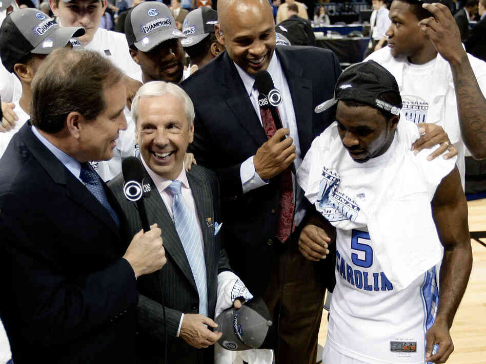 The NCAA lost control of college football contracts in the 1980s, forcing it to rely on fees paid to broadcast its annual basketball tournament. Here, CBS broadcasters Jim Nantz, left, and Clark Kellogg interview North Carolina coach Roy Williams and player Ty Lawson after a 2009 game.