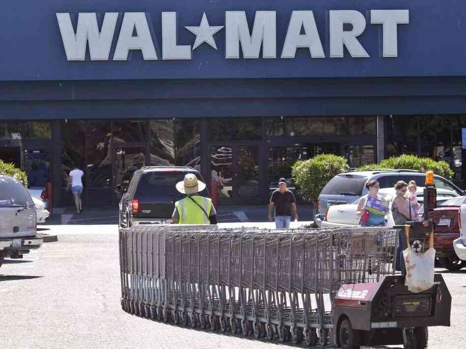 In virtually every county, there is a Walmart open every hour of every day, and every one of those Walmarts is being visited by 37,000 people a week — that's 220 people an hour, in every Walmart, every hour of the day. Here, a Walmart worker pulls carts at a store in Pittsburg, Calif. In virtually every county, there is a Walmart open every hour of every day, and every one of those Walmarts is being visited by 37,000 people a week — that's 220 people an hour, in every Walmart, every hour of the day. Here, a Walmart worker pulls carts at a store in Pittsburg, Calif.