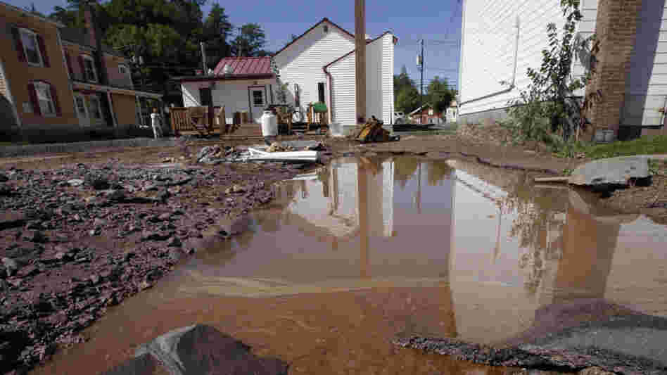 Water mixed with gasoline accumulated in the Zerega's pizzeria parking lot last month in Windham, N.Y. More than a dozen towns in Vermont and at least three in New York were cut off, with roads and bridges washed out by flooding caused by Tropical Storm Irene. Water mixed with gasoline accumulated in the Zerega's pizzeria parking lot last month in Windham, N.Y. More than a dozen towns in Vermont and at least three in New York were cut off, with roads and bridges washed out by flooding caused by Tropical Storm Irene.
