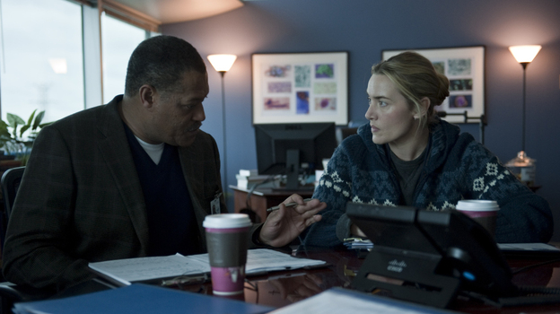 Laurence Fishburne as Dr. Ellis Cheever and Kate Winslet as Dr. Erin Mears in the thriller Contagion. Winslet's character was modeled on CDC epidemiologist Dr. Anne Schuchat.