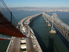 Catwalks hang over a section of the newly constructed eastern span of the San Francisco-Oakland Bay Bridge in Oakland, Calif. Catwalks hang over a section of the newly constructed eastern span of the San Francisco-Oakland Bay Bridge in Oakland, Calif.