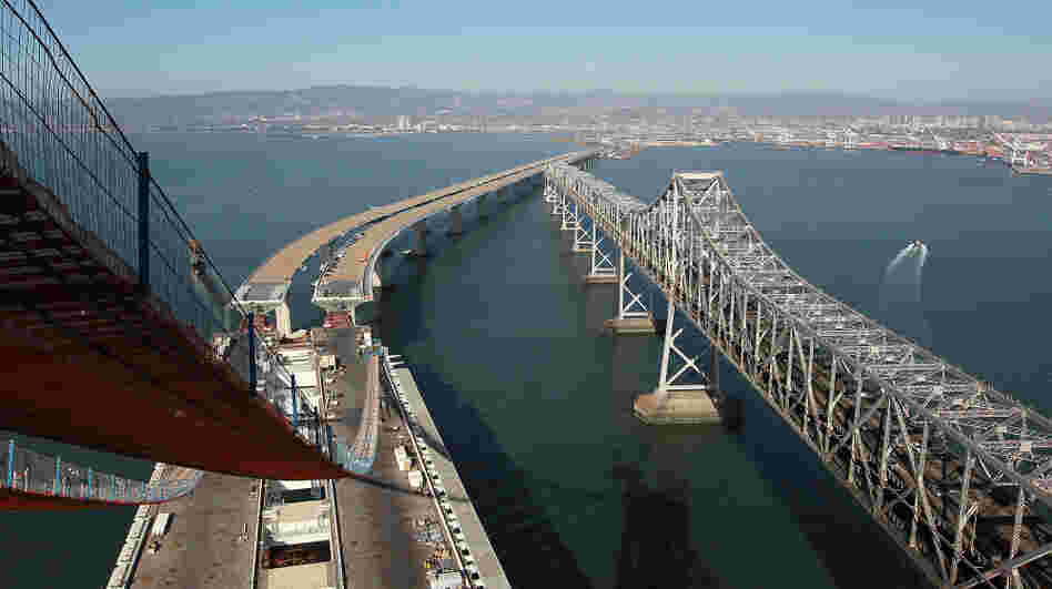 Catwalks hang over a section of the newly constructed eastern span of the San Francisco-Oakland Bay Bridge in Oakland, Calif.
