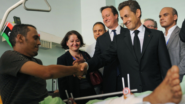 British Prime Minister David Cameron, center, and French President Nicholas Sarkozy, second right, visited with patients at the Tripoli Medical Center today (Sept. 15, 2011).