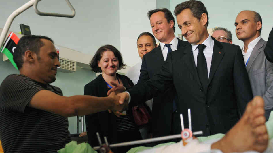 British Prime Minister David Cameron, center, and French President Nicholas Sarkozy, second right, visited with patients at the Tripoli Medical Center today (Sept. 15, 2011).