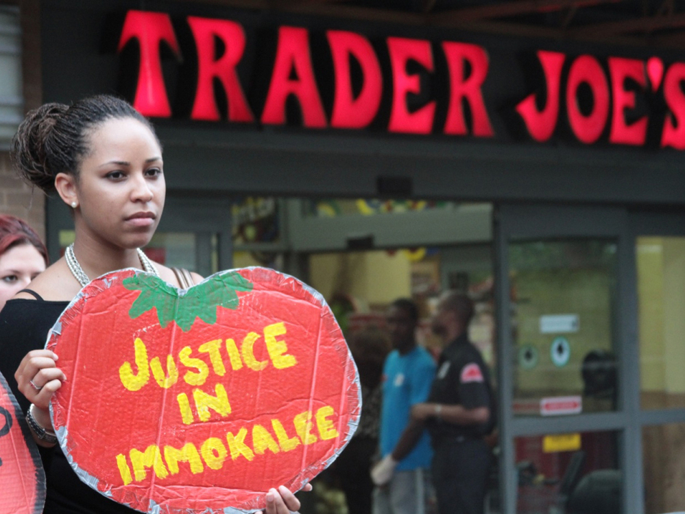 A protester outside a Trader Joe's in Washington, D.C. The Coalition of Immokalee Workers, which organized the protest, says Trader Joe's has refused to meet standards set by leaders of the  fast-food and foodservice industries for a more humane tomato  supply chain.