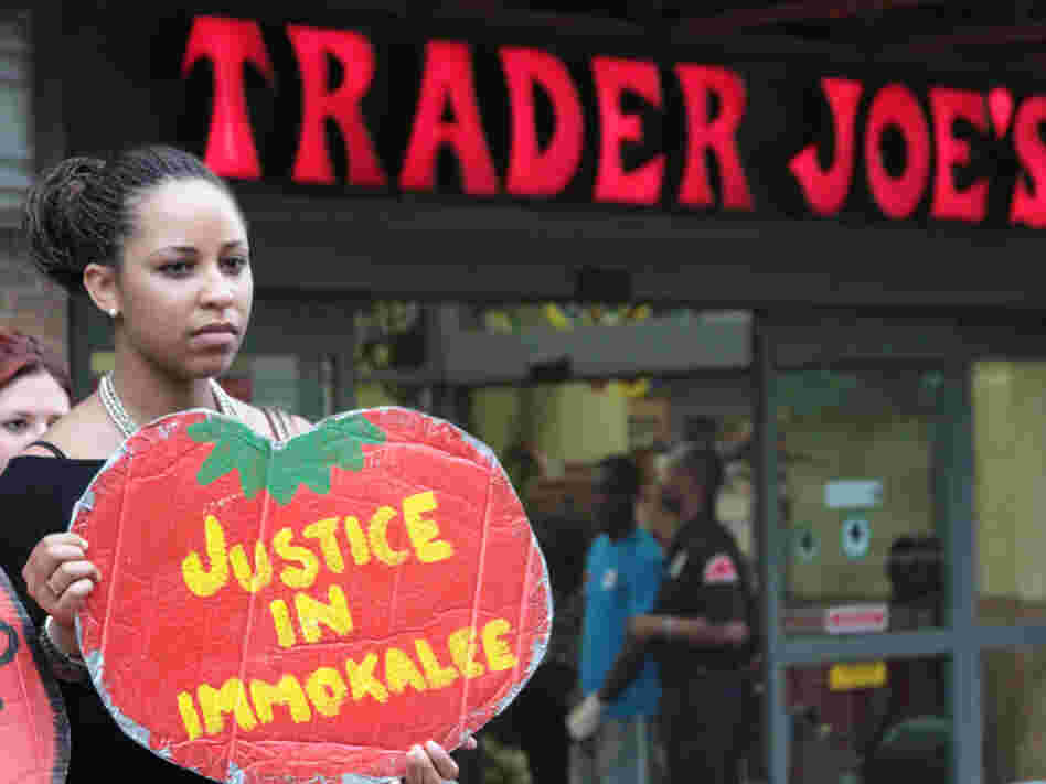 A protester outside a Trader Joe's in Washington, D.C. The Coalition of Immokalee Workers, which organized the protest, says Trader Joe's has refused to meet standards set by leaders of the  fast-food and foodservice industries for a more humane tomato  supply chain.