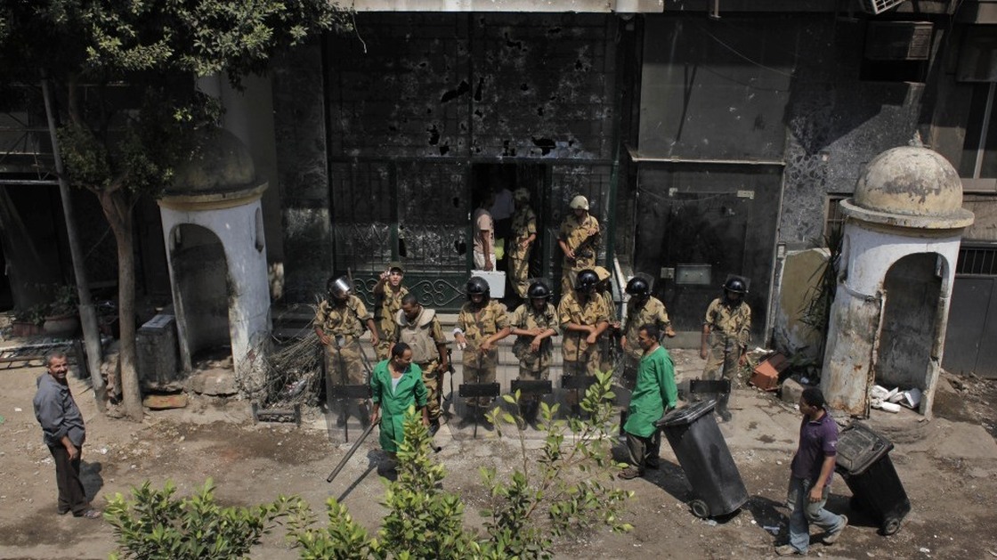 Egyptian soldiers guard the badly damaged entrance of the Israeli Embassy in Cairo on Sunday. Protesters stormed the embassy, contributing to the worst diplomatic crisis between the two countries since they signed a peace treaty in 1979.