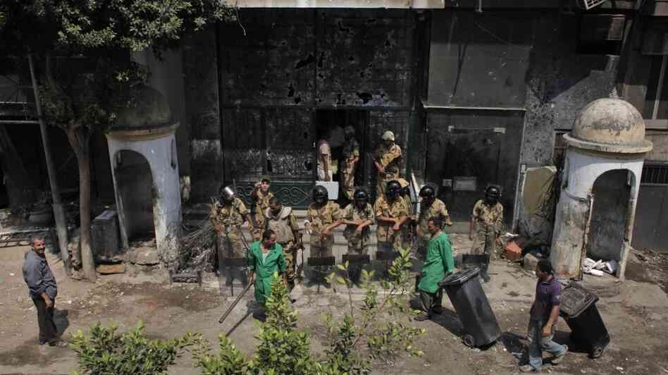 Egyptian soldiers guard the badly damaged entrance of the Israeli Embassy in Cairo on Sunday. Protesters stormed the embassy, contributing to the worst diplomatic crisis between the two countries since they signed a peace treaty in 1979.