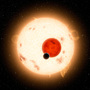 NASA's Kepler mission has discovered a planet that circles two stars instead of one. The planet, shown as the black dot in this artist's illustration, is similar to Saturn, though it is more dense and travels in a 229-day circular orbit around its two stars.