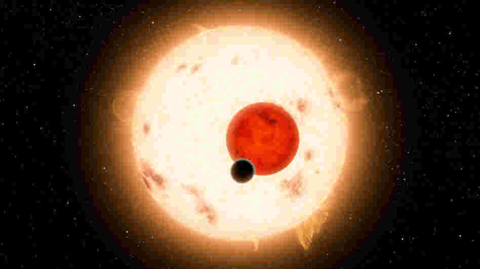 NASA's Kepler mission has discovered a planet that circles two stars instead of one. The planet, shown as the black dot in this artist's illustration, is similar to Saturn, though it is more dense and travels in a 229-day circular orbit around its two stars. NASA's Kepler mission has discovered a planet that circles two stars instead of one. The planet, shown as the black dot in this artist's illustration, is similar to Saturn, though it is more dense and travels in a 229-day circular orbit around its two stars.