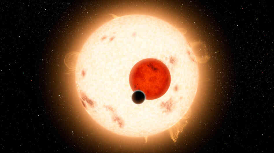 NASA's Kepler mission has discovered a planet that circles two stars instead of one. The planet, shown as the black dot in this artist's illustration, is similar to Saturn, though it is more dense and travels in a 229-day circular orbit around its two stars. NASA's Kepler mission has discovered a planet that circles two stars instead of one. The planet, shown as the black dot in this artist's illustration, is similar to Saturn, though it is more dense and travels in a 229-day circular orbit around its two stars.