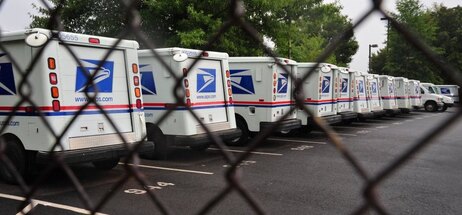 U.S. Postal Service mail delivery trucks sit idle at the Manassas post office in Virginia on September 5. U.S. Postal Service mail delivery trucks sit idle at the Manassas post office in Virginia on September 5.