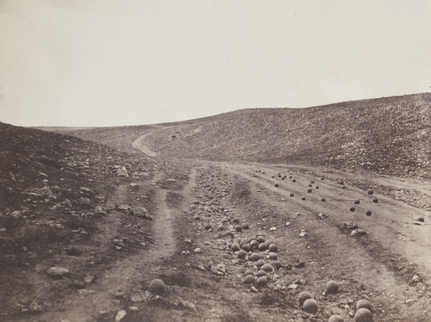 Some believe photographer Roger Fenton placed the cannonballs on the Ukrainian road during the Crimean War himself. Some believe photographer Roger Fenton placed the cannonballs on the Ukrainian road during the Crimean War himself.