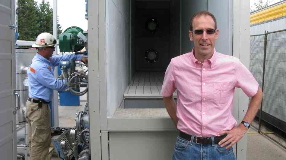 David Keith (right) stands in front of his air capture prototype on the University of Calgary campus. David Keith (right) stands in front of his air capture prototype on the University of Calgary campus.
