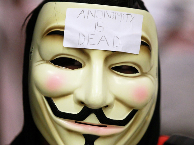 A demonstrator wears a Guy Fawkes mask typically worn by followers of  the cyberguerrilla group Anonymous during an Aug. 15 protest inside a  Bay Area Rapid Transit station in San Francisco.
